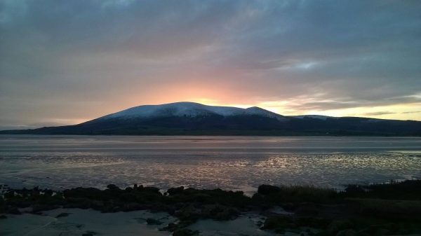 Criffel with a dusting of snow and sunset behind - Wood Fuel Co-operative