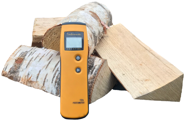 kiln-dried birch logs with a moisture meter - Wood Fuel Co-operative