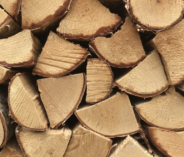 Close up of split kiln-dried birch logs - Wood Fuel Co-operative
